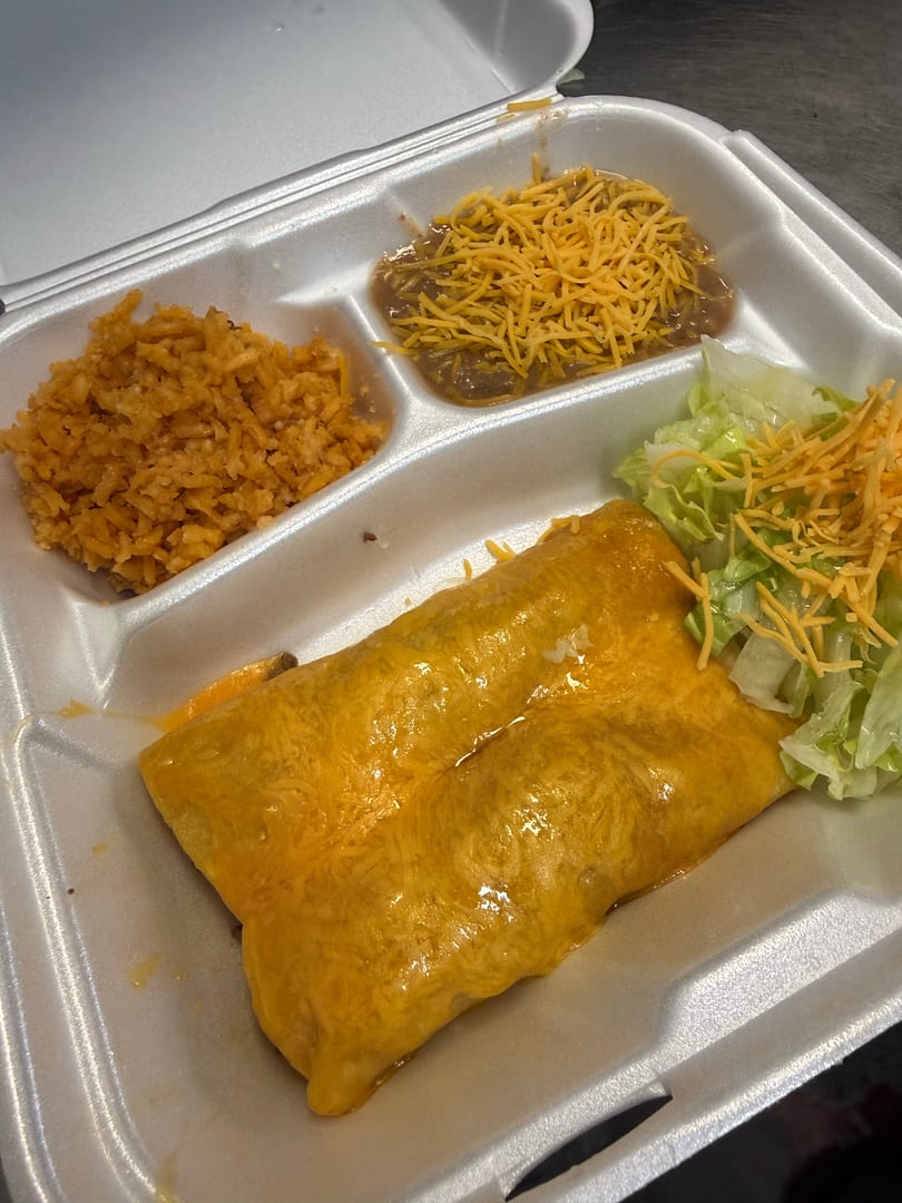 A takeout container with two cheese enchiladas, rice, refried beans, and a side salad.